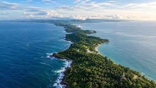 Narrow strip of land between two seas, like the Isthmus of Panama joining North and South America